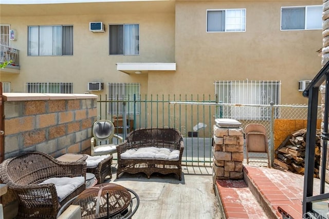 balcony with an outdoor living space and a patio area