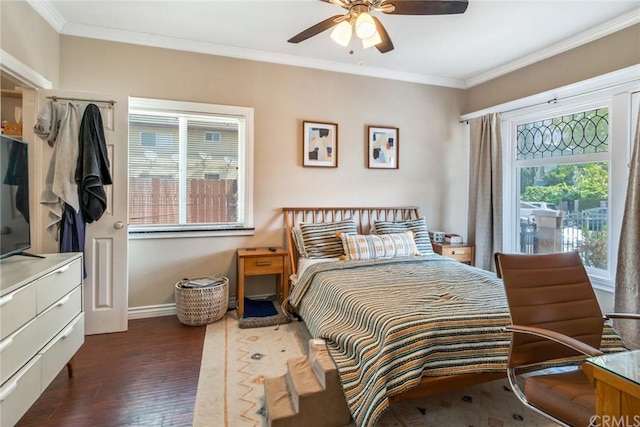 bedroom with ceiling fan, dark hardwood / wood-style flooring, and ornamental molding