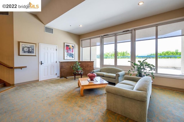 living room with plenty of natural light and carpet