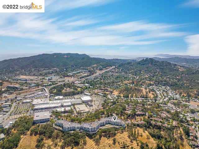 birds eye view of property with a mountain view