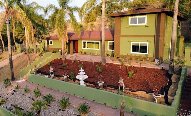 view of front of house featuring stucco siding