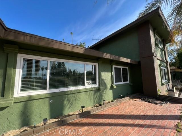 view of side of property featuring a patio area