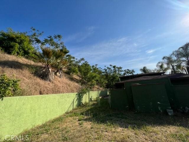 view of yard with fence