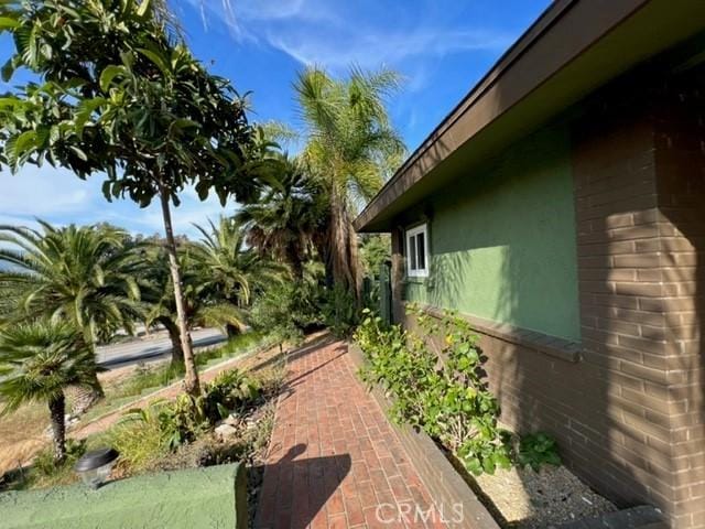 view of side of property featuring stucco siding