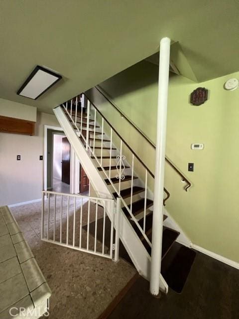 stairway with baseboards