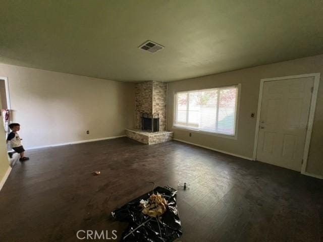 unfurnished living room featuring a fireplace