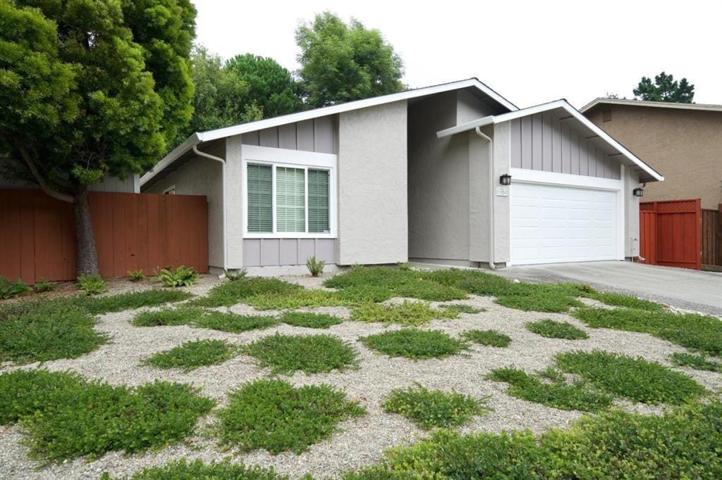 ranch-style home featuring a garage