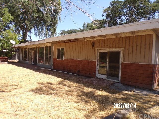 rear view of house with a lawn