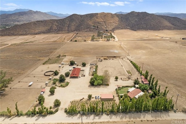 birds eye view of property with a mountain view