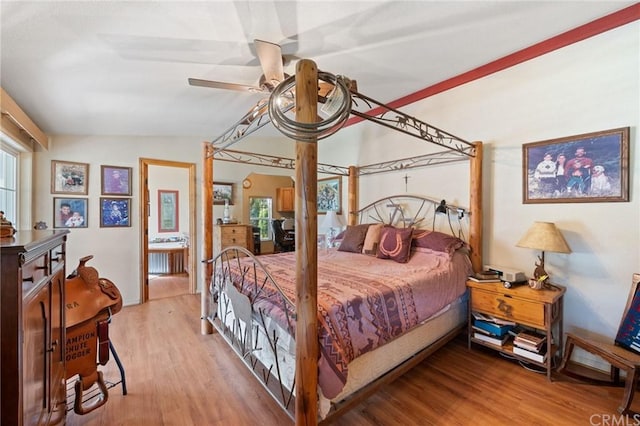 bedroom featuring multiple windows, light hardwood / wood-style floors, and ceiling fan