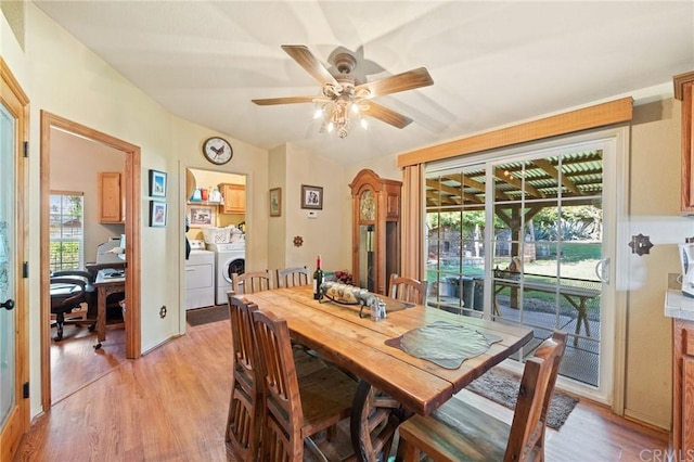 dining space with separate washer and dryer, light hardwood / wood-style floors, and ceiling fan