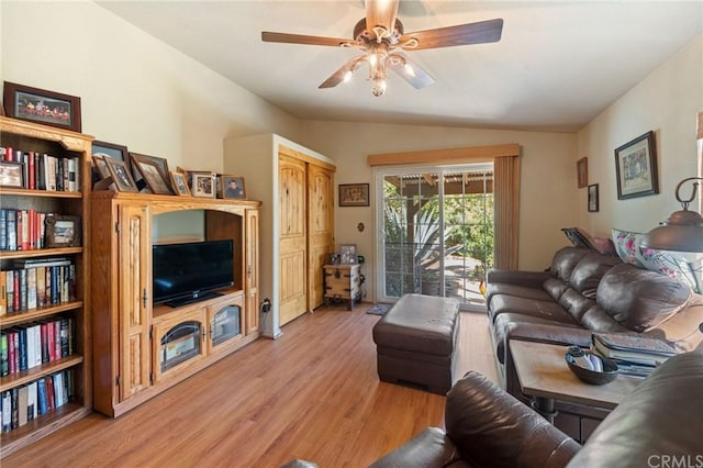 living room featuring lofted ceiling, light hardwood / wood-style floors, and ceiling fan