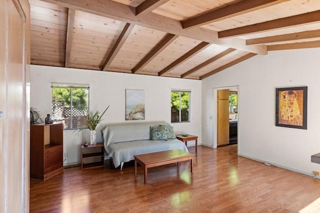 living room with hardwood / wood-style flooring and lofted ceiling with beams