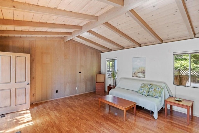 living area featuring wood walls, wooden ceiling, light hardwood / wood-style floors, and lofted ceiling with beams