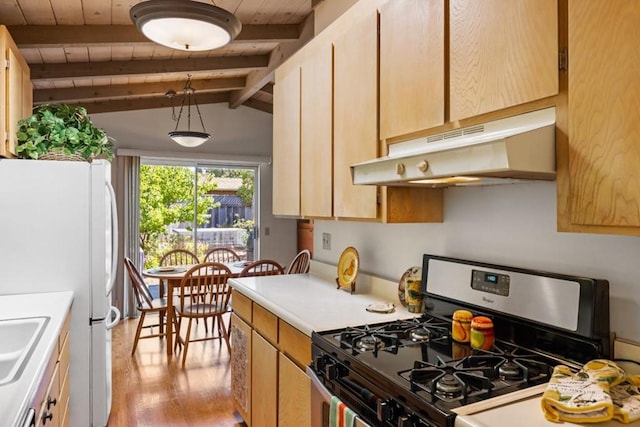 kitchen with white fridge, vaulted ceiling with beams, wood ceiling, range with gas cooktop, and light wood-type flooring