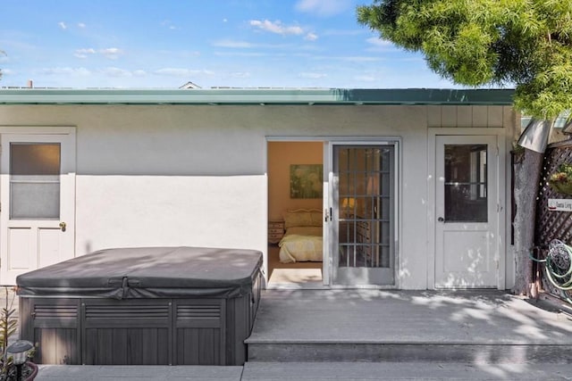 exterior space with a hot tub