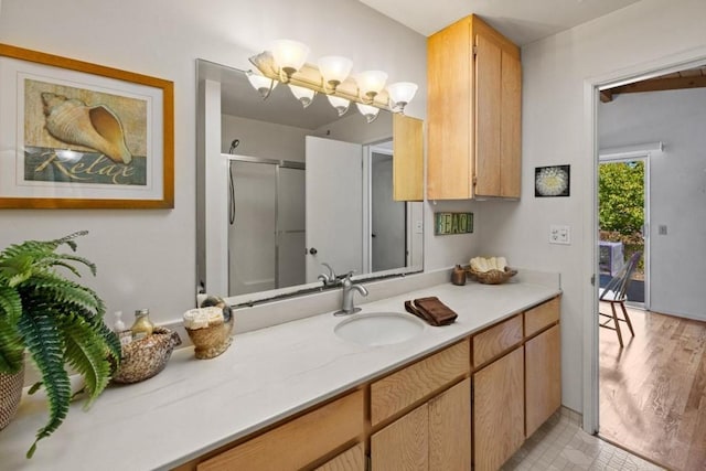 bathroom with oversized vanity and hardwood / wood-style flooring