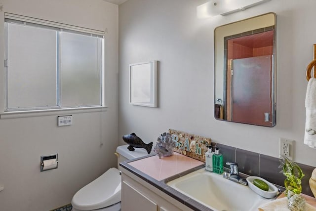 bathroom with oversized vanity and toilet