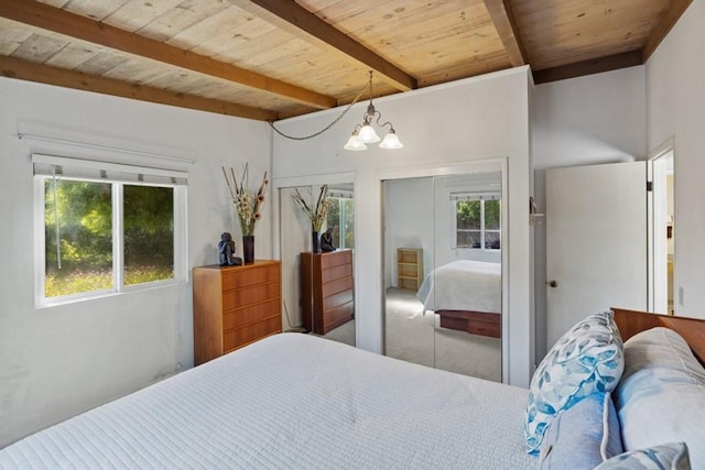 bedroom featuring beam ceiling, wood ceiling, a notable chandelier, and carpet