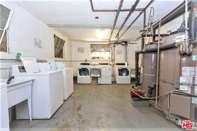 clothes washing area featuring washer and dryer