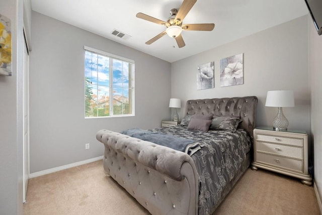 bedroom with light carpet and ceiling fan