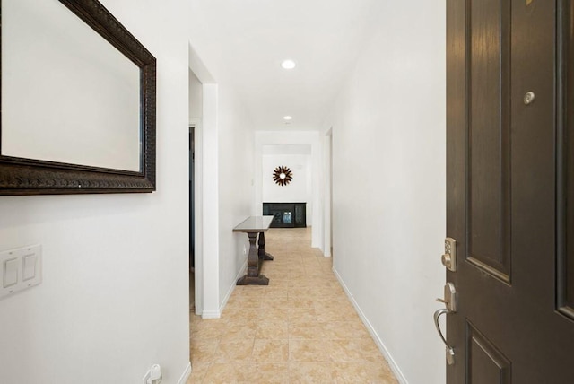 corridor featuring light tile floors