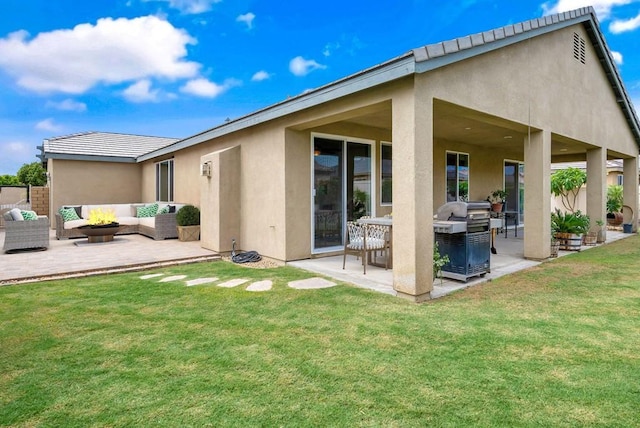 back of house with an outdoor hangout area, a patio area, and a yard