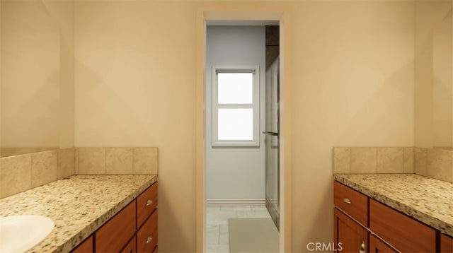 bathroom featuring vanity and decorative backsplash