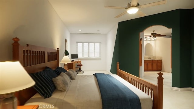 carpeted bedroom featuring ceiling fan, ensuite bathroom, and sink