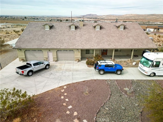 view of front of home featuring a mountain view and a garage