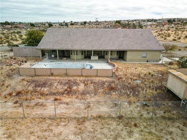 back of property with a patio area