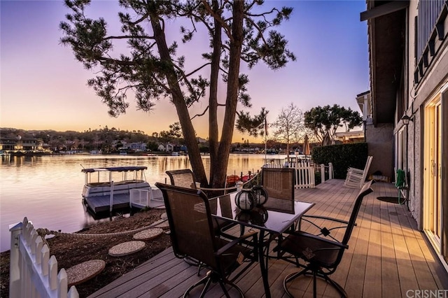 exterior space featuring a water view and a boat dock