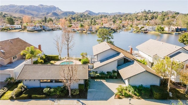 bird's eye view with a water and mountain view