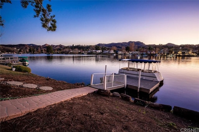 dock area featuring a water and mountain view