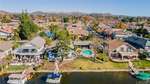 bird's eye view featuring a water and mountain view