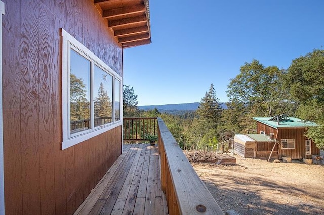 wooden terrace with an outdoor structure