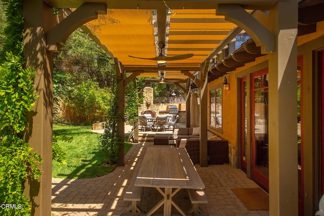 view of patio featuring ceiling fan and french doors