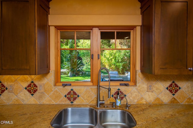 kitchen with sink, tasteful backsplash, and plenty of natural light