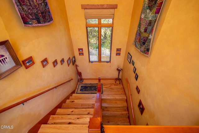 stairs with light wood-type flooring