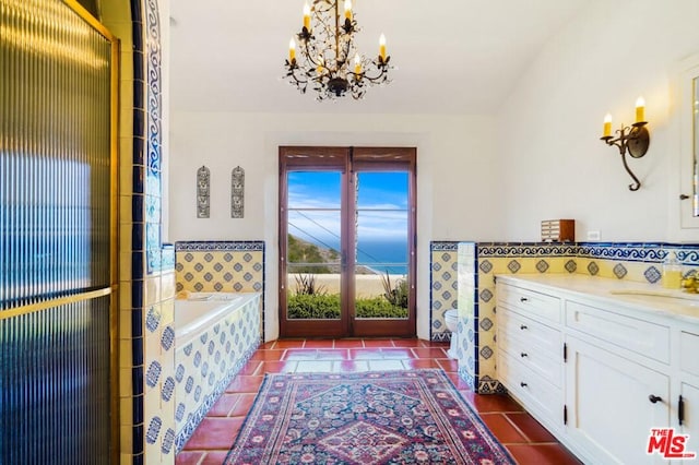 full bathroom featuring an inviting chandelier, french doors, tile flooring, toilet, and vanity