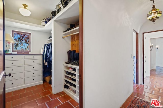 spacious closet featuring light tile floors