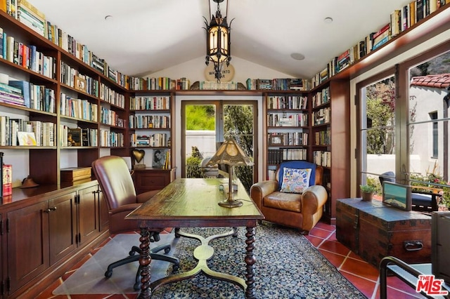 tiled home office featuring vaulted ceiling