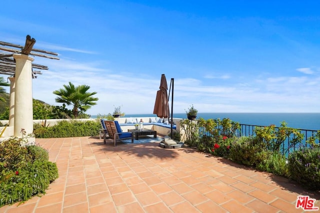 view of patio with a water view