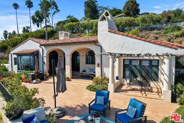 back of house featuring a patio