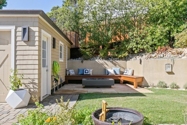 exterior space with an outdoor living space with a fire pit