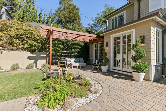 view of patio with outdoor lounge area, french doors, and a pergola