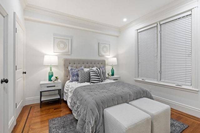 bedroom featuring crown molding and hardwood / wood-style floors