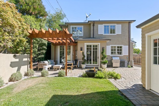 rear view of property with a pergola, outdoor lounge area, a patio area, central air condition unit, and a yard