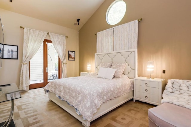 carpeted bedroom with access to outside and lofted ceiling