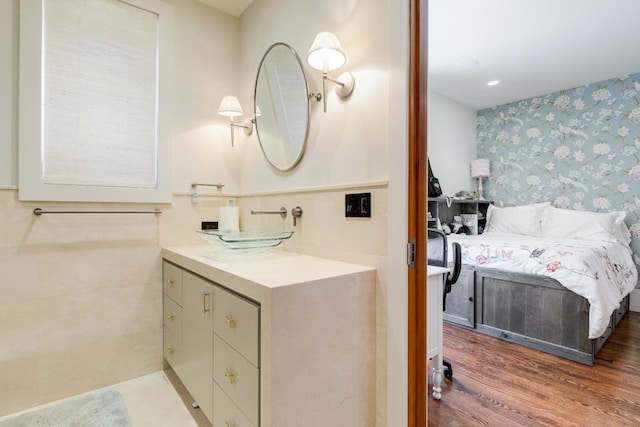 bathroom with hardwood / wood-style flooring and vanity